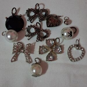 collection of vintage-style jewelry charms